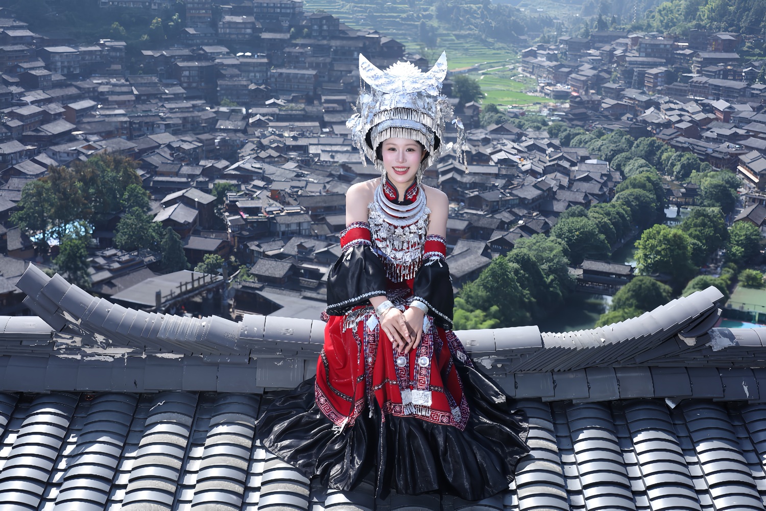 NiceNIC founder May Fung during her family journey through Guizhou, surrounded by the architecture and traditions that inspired this reflection.